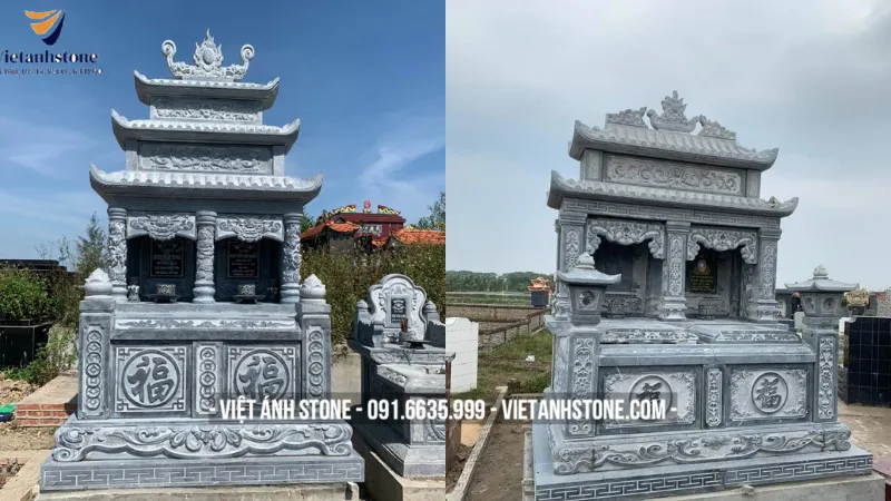 Mộ đá hai mái chạm khắc rồng phượng tinh xảo, thể hiện uy quyền và sự tôn kính với tổ tiên.